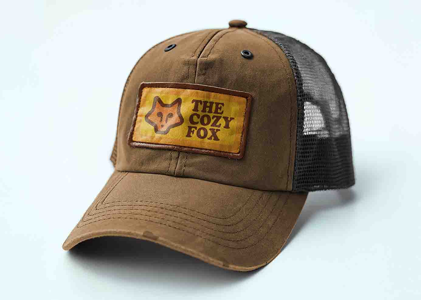 The Cozy Fox logo on a hat patch