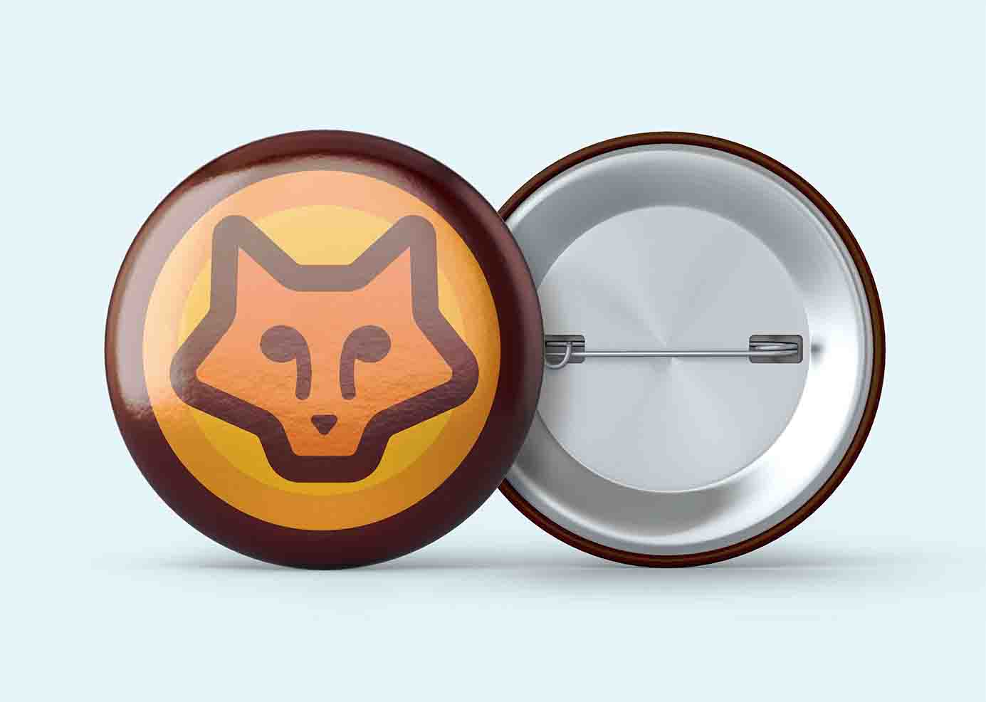 The Cozy Fox logo in a circular pin